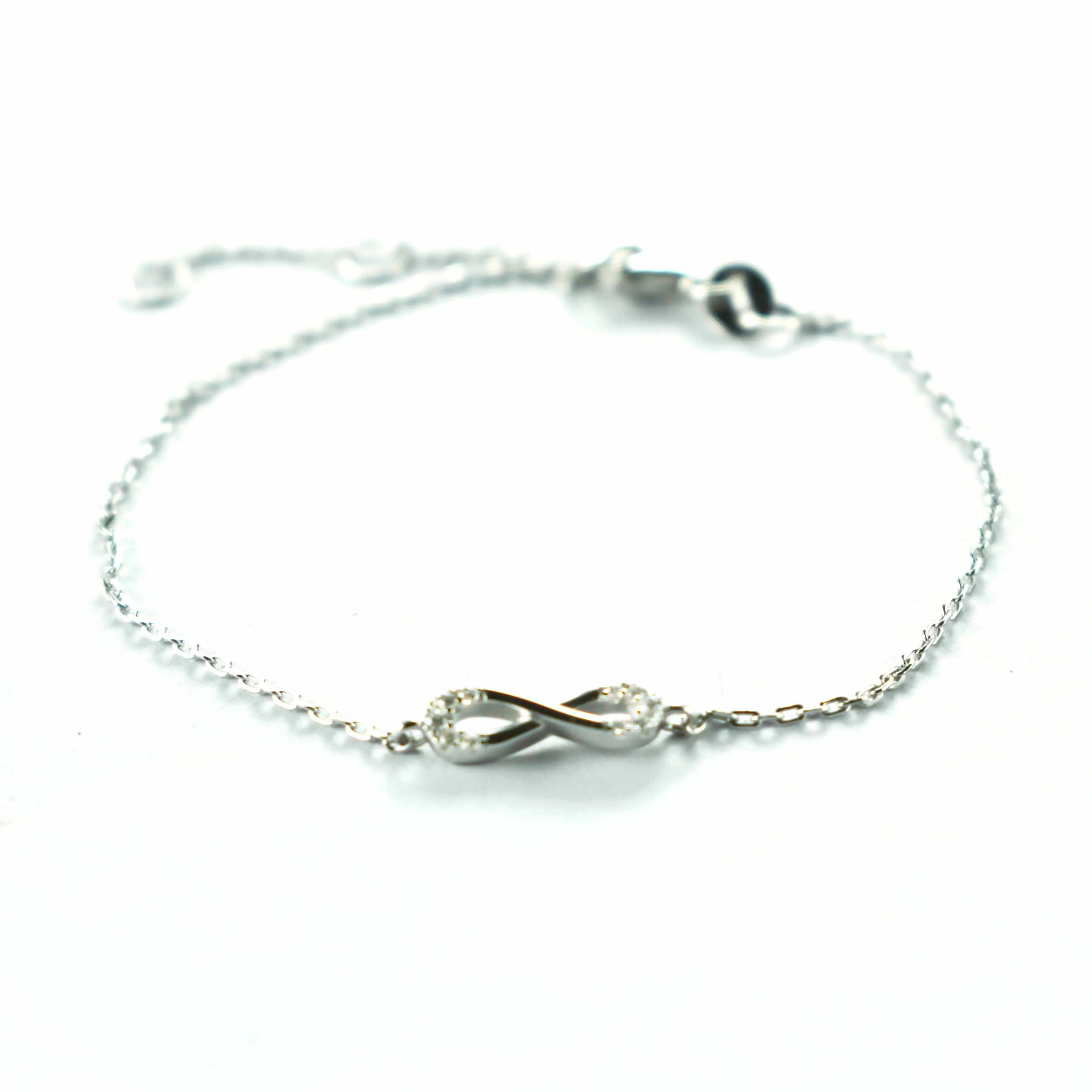 Bow pattern silver bracelet with white CZ & platinum plating