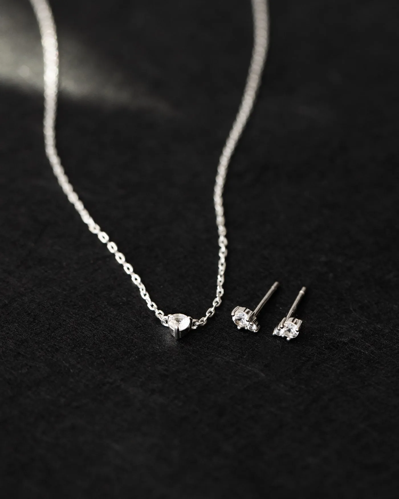 Radiant Sterling Silver Necklace with Polished White Sapphire Gemstone